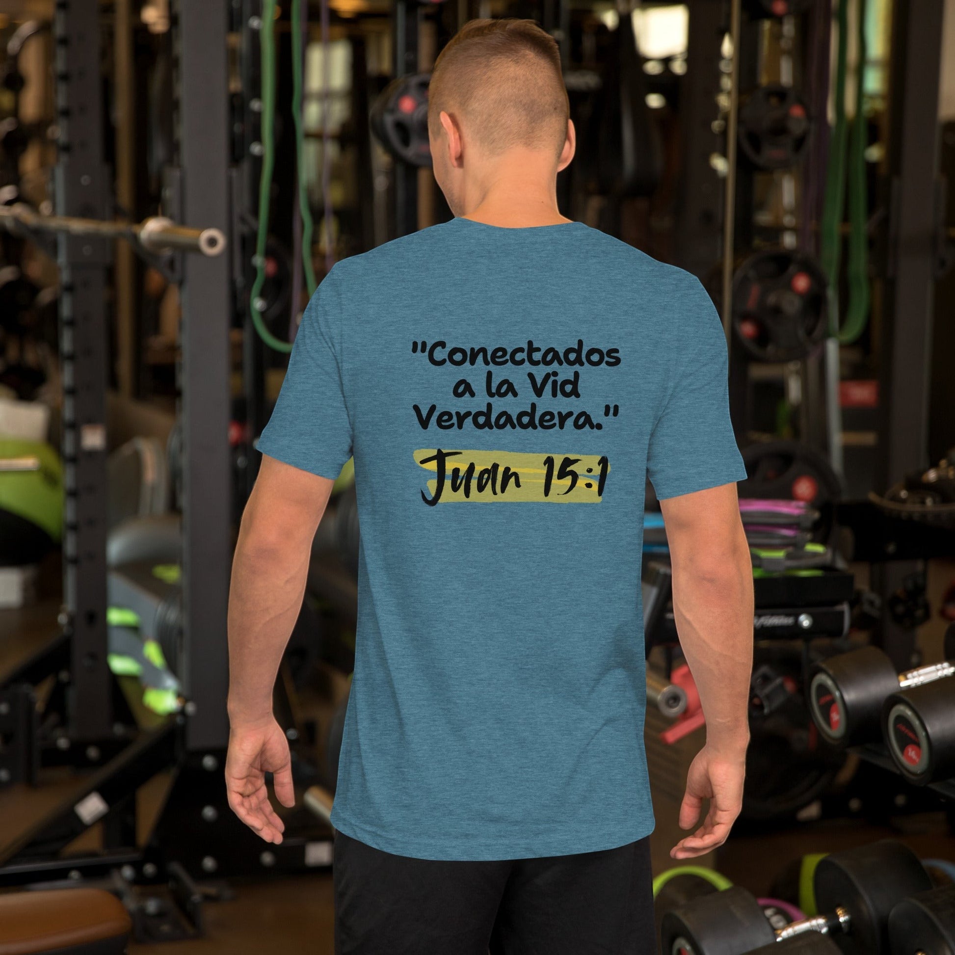 Crown & Cross Co. teal crewneck t-shirt with Spanish text "Conectados a la Vid Verdadera." and "Juan 15:1" printed on the back.