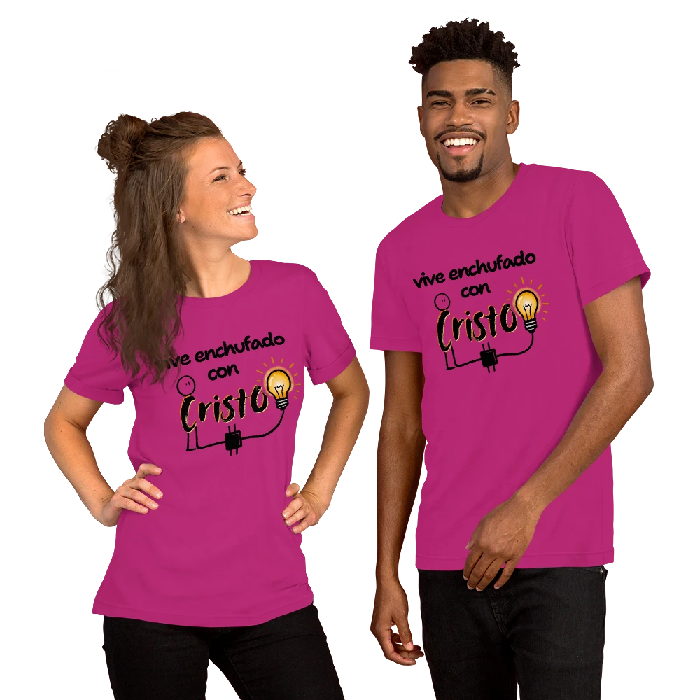 Crown & Cross Co. unisex magenta 100% cotton t-shirt with "Vive Enchufado con Cristo" graphic. Modern streetwear style.