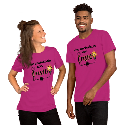 Crown & Cross Co. unisex magenta 100% cotton t-shirt with "Vive Enchufado con Cristo" graphic. Modern streetwear style.