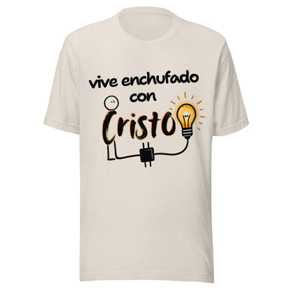 Crown & Cross Co cream 100% cotton unisex t-shirt with a graphic print on the front featuring a stick figure connected to a lightbulb and the text "vive enchufado con Cristo".