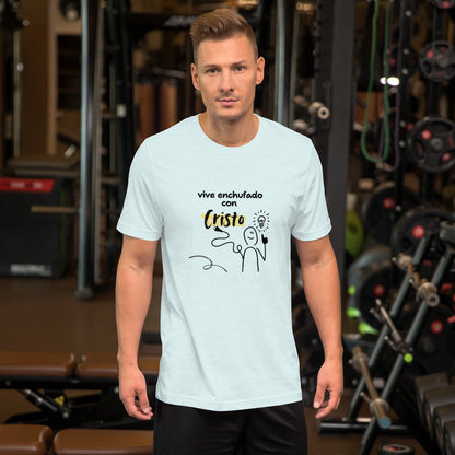 Crown & Cross Co white 100% cotton t-shirt with a graphic print of a stick figure holding a lightbulb and a plug, text reads "vive enchufado con Cristo".
