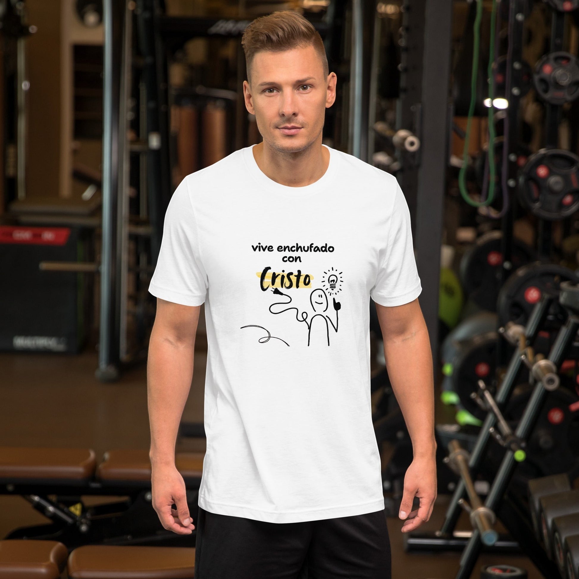 Crown & Cross Co white 100% cotton t-shirt with a graphic print of a stick figure holding a lightbulb and a plug, text reads "vive enchufado con Cristo"